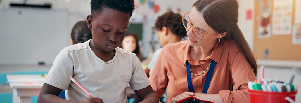 Writing Teacher helping student with a writing assignment